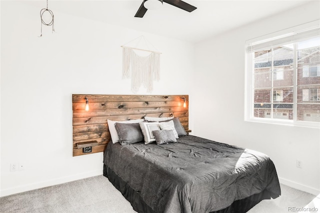 bedroom featuring ceiling fan and carpet