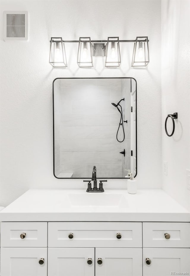 bathroom with vanity and walk in shower