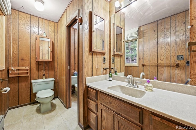 2169 Vigilante Ave, Bailey, CO 80421 - bathroom featuring vanity, wood walls, tile patterned flooring, and a baseboard radiator