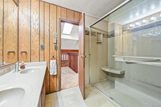 2169 Vigilante Ave, Bailey, CO 80421 - bathroom with tile patterned floors, a shower stall, and double vanity