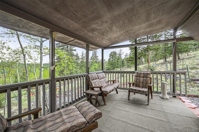 2169 Vigilante Ave, Bailey, CO 80421 - sunroom with vaulted ceiling, view of scattered trees, and healthy amount of natural light