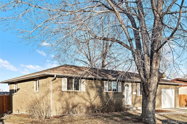 ranch-style house featuring a garage