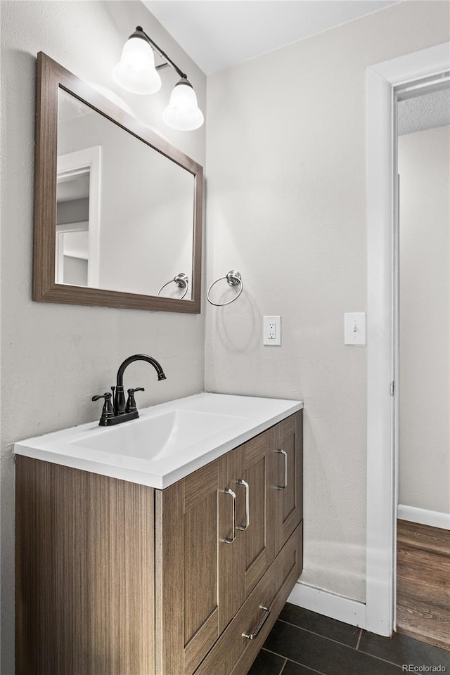 bathroom featuring vanity and tile patterned flooring