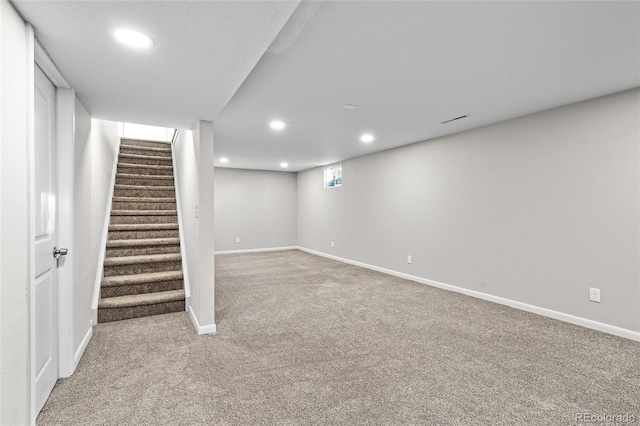 basement with light colored carpet