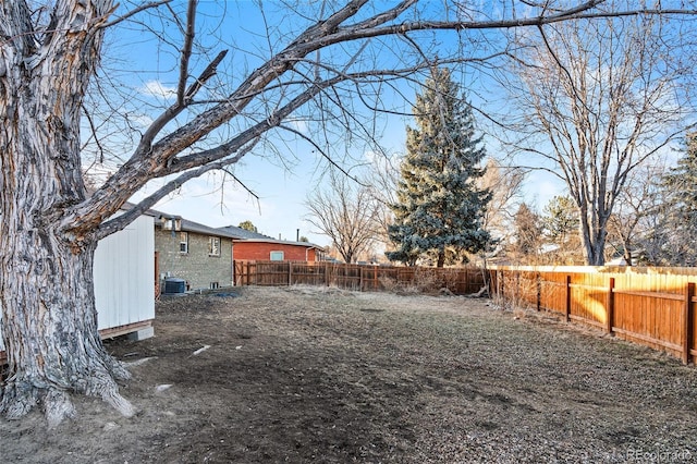 view of yard with central AC unit