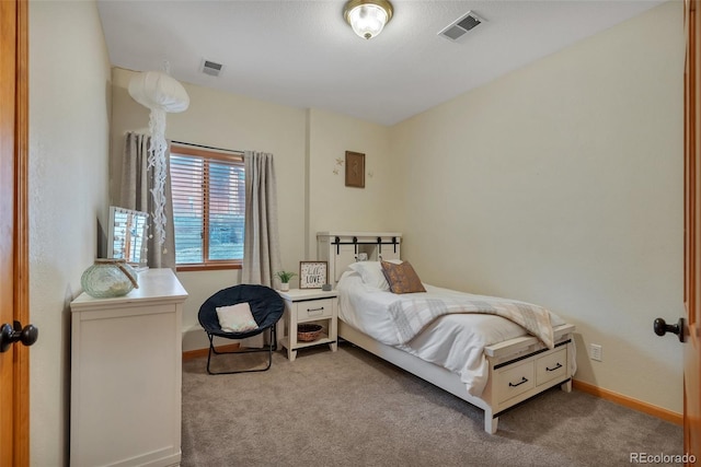 bedroom with baseboards, visible vents, and carpet floors