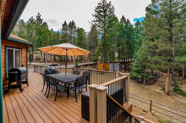 deck featuring outdoor dining area