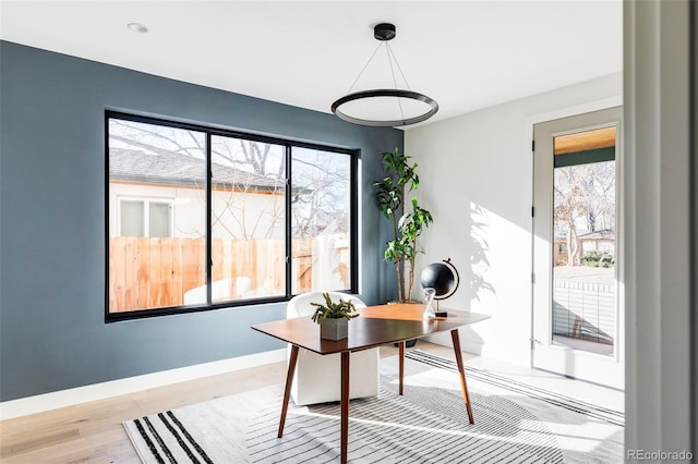 office with light hardwood / wood-style flooring