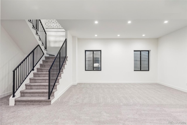 interior space featuring light colored carpet