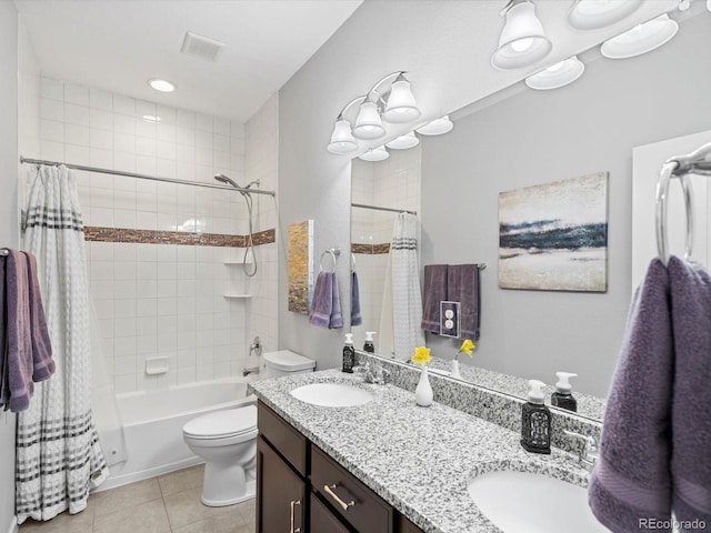 full bathroom with a sink, visible vents, toilet, and tile patterned flooring