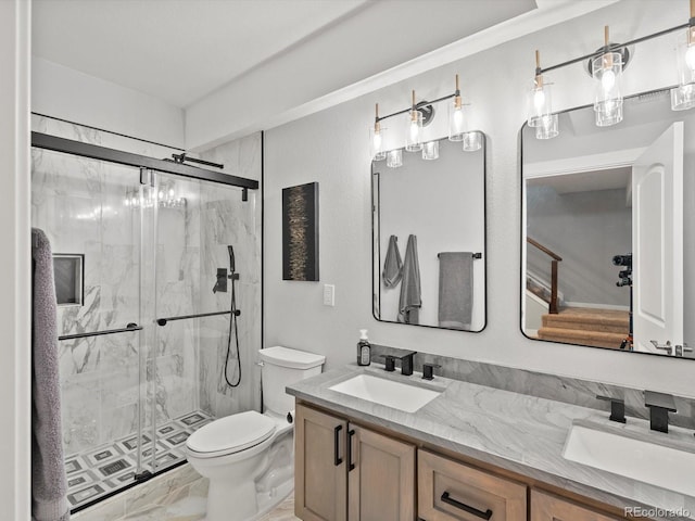 full bathroom with toilet, marble finish floor, a sink, and a marble finish shower