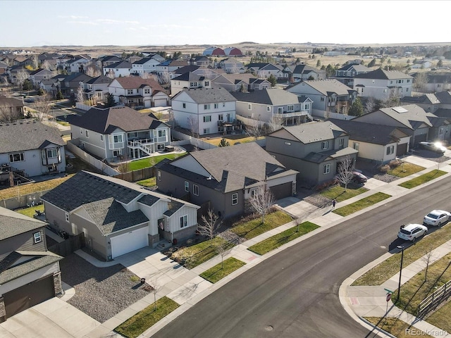 birds eye view of property with a residential view