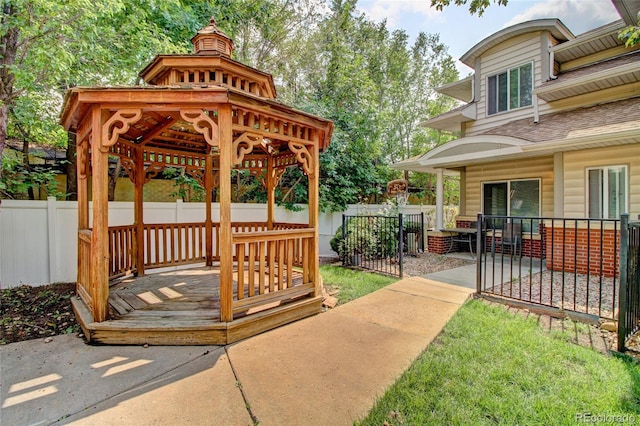 exterior space with a lawn and a gazebo