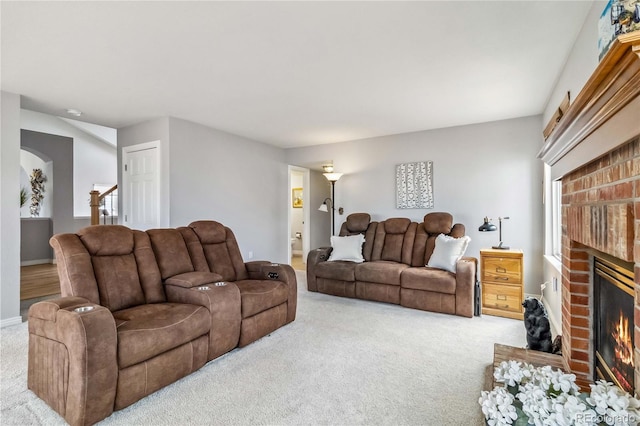 12551 W 84th Cir, Arvada, CO 80005 - carpeted living area featuring baseboards and a brick fireplace