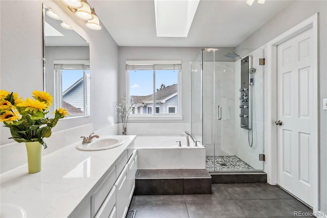 12551 W 84th Cir, Arvada, CO 80005 - full bath with a shower stall, tile patterned floors, double vanity, a sink, and a garden tub