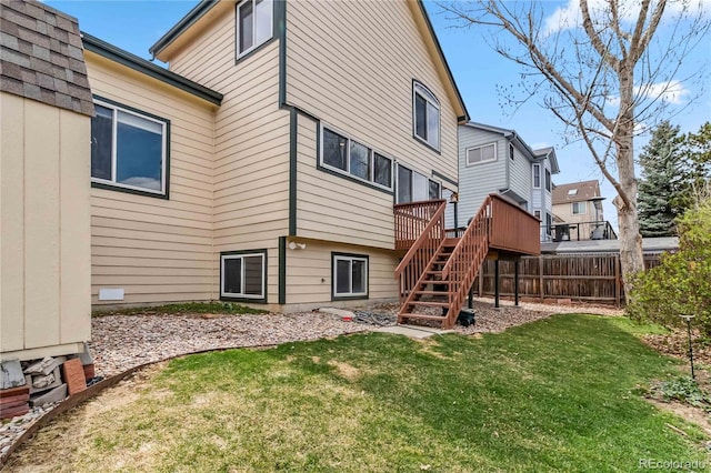 12551 W 84th Cir, Arvada, CO 80005 - back of property with a yard, stairway, fence, and a deck