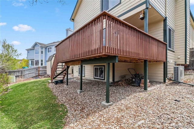 12551 W 84th Cir, Arvada, CO 80005 - back of property with a yard, fence, a deck, and stairs
