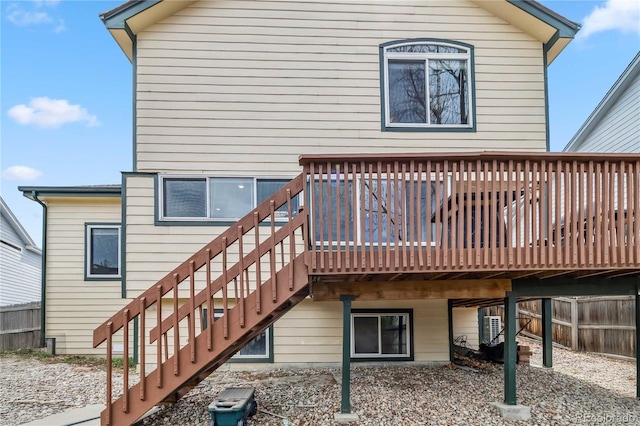 12551 W 84th Cir, Arvada, CO 80005 - rear view of property with fence, stairs, and a deck