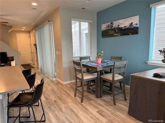 dining area with light wood-type flooring