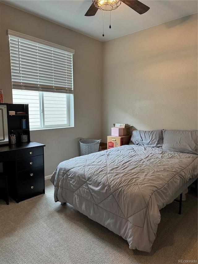 bedroom featuring ceiling fan and carpet floors