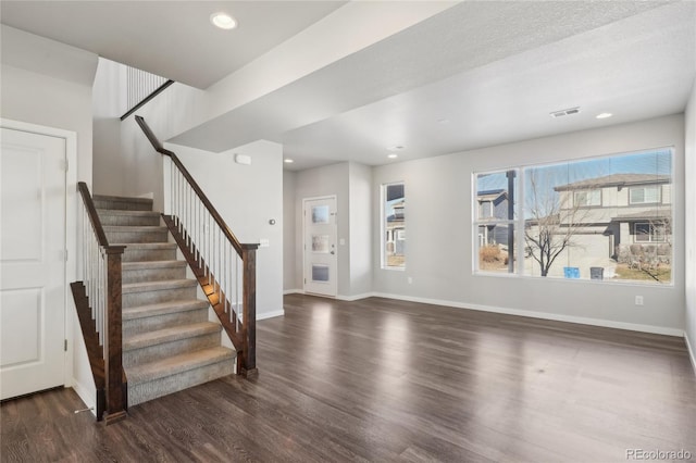 interior space featuring recessed lighting, visible vents, baseboards, and wood finished floors