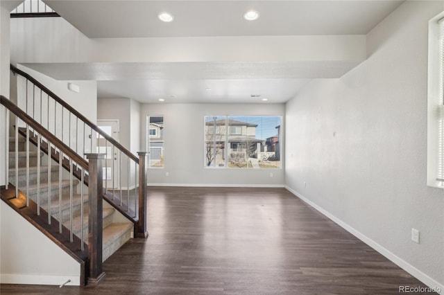 entrance foyer featuring stairs, baseboards, wood finished floors, and recessed lighting