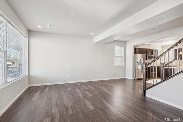 unfurnished room featuring dark wood-style floors, stairs, baseboards, and recessed lighting