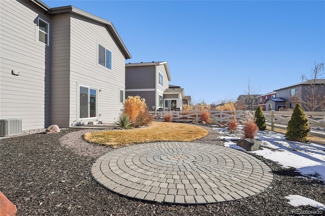 exterior space featuring central air condition unit, a patio, and fence