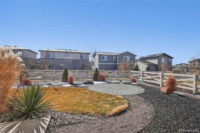 view of yard with fence and a residential view