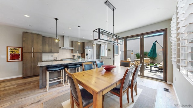 1426 S Pearl St, Denver, CO 80210 - dining area featuring light wood-style flooring and recessed lighting