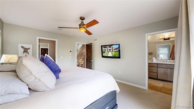 1426 S Pearl St, Denver, CO 80210 - bedroom with ensuite bath, light colored carpet, and a ceiling fan