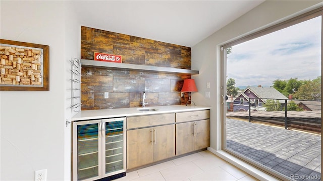 1426 S Pearl St, Denver, CO 80210 - indoor wet bar with wine cooler, tasteful backsplash, and light tile patterned floors