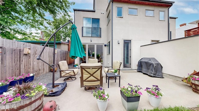 1426 S Pearl St, Denver, CO 80210 - patio / terrace featuring grilling area, a fenced backyard, and a patio area