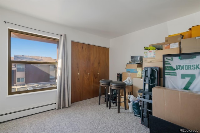 carpeted home office featuring baseboard heating