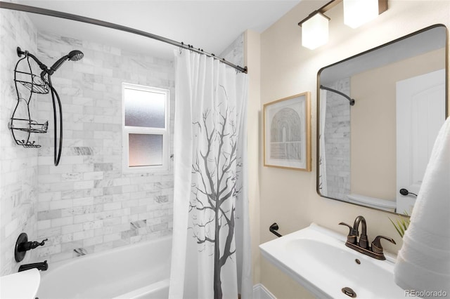 bathroom featuring a sink and shower / bath combo
