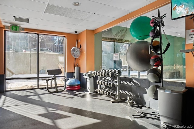 workout area featuring a drop ceiling