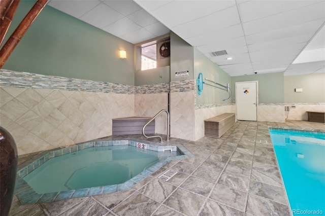 view of pool featuring an indoor hot tub