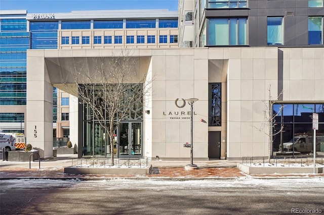 view of snow covered property entrance