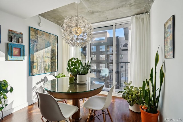 dining area featuring a notable chandelier and wood-type flooring