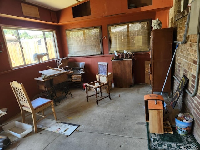 3036 W Clyde Pl, Denver, CO 80211 - sitting room with an office area and unfinished concrete floors