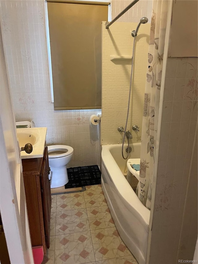 3036 W Clyde Pl, Denver, CO 80211 - bathroom featuring tile walls, vanity, and shower / tub combo