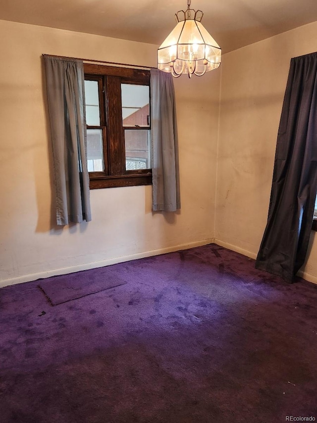 3036 W Clyde Pl, Denver, CO 80211 - carpeted spare room with a chandelier and baseboards