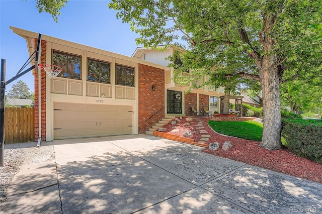 3752 S Helena Way, Aurora, CO 80013 - mid-century home with driveway, brick siding, and a garage