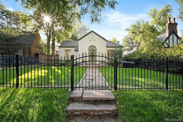 view of gate with a yard