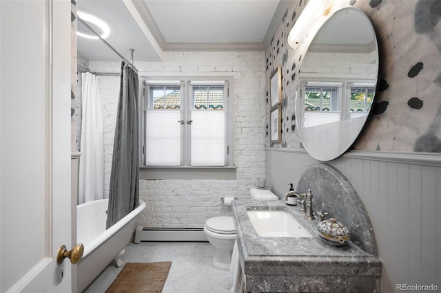 full bathroom with a baseboard heating unit, toilet, shower / bath combo, and vanity