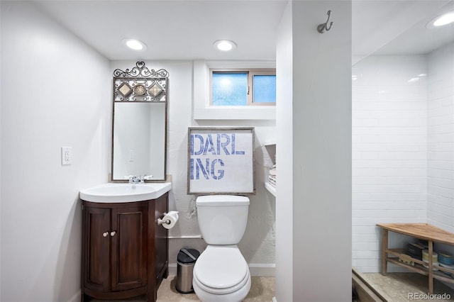 bathroom featuring toilet and vanity