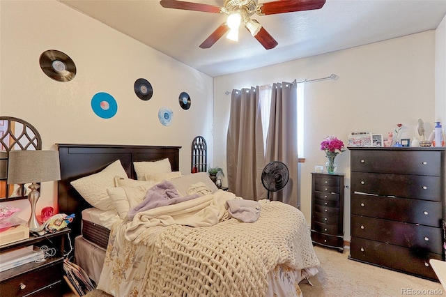 bedroom featuring a ceiling fan and light carpet