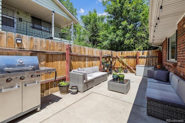 7905 Lowell Blvd Unit B, Westminster, CO 80030 - view of patio / terrace featuring an outdoor living space and a grill
