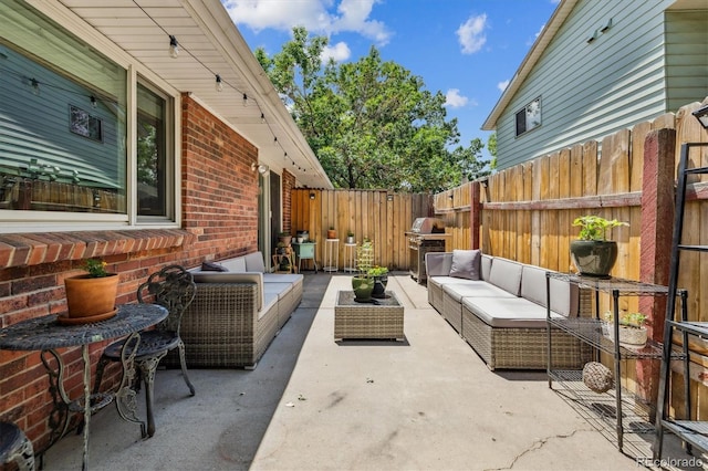 7905 Lowell Blvd Unit B, Westminster, CO 80030 - fenced backyard featuring an outdoor living space, a patio, and area for grilling