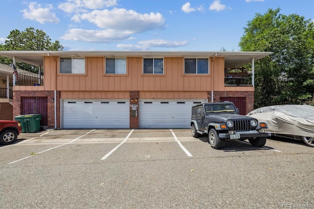 7905 Lowell Blvd Unit B, Westminster, CO 80030 - view of front of property featuring brick siding and an attached garage